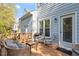 Enjoy outdoor living on this home's deck with furniture and a grill at 1601 Dunraven Dr, Raleigh, NC 27612