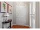 Bright entryway featuring parquet floors, white door, and elegant decor at 1601 Dunraven Dr, Raleigh, NC 27612