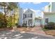 Charming two-story home with blue siding, black shutters, chimney, and well-manicured landscaping at 1601 Dunraven Dr, Raleigh, NC 27612