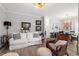 Bright and airy living room featuring hardwood floors and a cozy seating area at 1601 Dunraven Dr, Raleigh, NC 27612