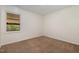 Cozy carpeted bedroom with a window offering a view to the exterior at 2024 Spring Creek Dr, Durham, NC 27704