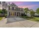 Two-story home with gray siding, black shutters, and a concrete driveway at 2024 Spring Creek Dr, Durham, NC 27704
