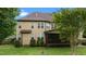 Exterior view of home with backyard lawn and a screened-in porch at 2053 Monthaven Dr, Wake Forest, NC 27587