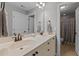 Bright bathroom with double vanity, granite countertop, and white cabinets at 2053 Monthaven Dr, Wake Forest, NC 27587