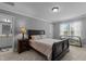 Bedroom featuring neutral walls, carpet, side tables, and dark wood furniture at 2053 Monthaven Dr, Wake Forest, NC 27587