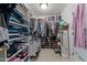 Walk-in closet with shelving and racks for clothes, shoes, and accessories at 2053 Monthaven Dr, Wake Forest, NC 27587