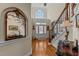Elegant foyer with hardwood floors, staircase, and arched doorway at 2053 Monthaven Dr, Wake Forest, NC 27587