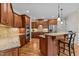 Gourmet kitchen with custom cabinetry, granite countertops, and stainless steel appliances at 2053 Monthaven Dr, Wake Forest, NC 27587