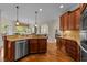 This kitchen features a large island, stainless steel appliances, and an adjacent dining area at 2053 Monthaven Dr, Wake Forest, NC 27587