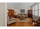 Cozy living room with hardwood floors, classic furniture, and natural light at 2053 Monthaven Dr, Wake Forest, NC 27587