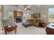 Inviting living room features a stone fireplace, coffered ceilings, and lots of natural light at 2053 Monthaven Dr, Wake Forest, NC 27587