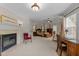 Spacious main bedroom with fireplace, sitting area, trey ceilings and ample natural light at 2053 Monthaven Dr, Wake Forest, NC 27587