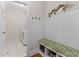 Convenient mud room with a bench, storage for shoes, and access to the laundry room at 2053 Monthaven Dr, Wake Forest, NC 27587