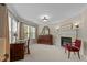 A home office with a fireplace, large windows, and a comfortable chair at 2053 Monthaven Dr, Wake Forest, NC 27587