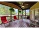 Inviting screened porch featuring comfortable seating and ceiling fan at 2053 Monthaven Dr, Wake Forest, NC 27587