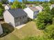 Aerial view of the backyard with a concrete patio and surrounding homes at 209 Oswego Ct, Morrisville, NC 27560