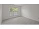 Empty bedroom with neutral carpet and single window at 209 Oswego Ct, Morrisville, NC 27560