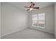 Bedroom with carpet, window and ceiling fan at 209 Oswego Ct, Morrisville, NC 27560
