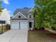 Charming two-story home with a two-car garage and well-manicured front yard at 209 Oswego Ct, Morrisville, NC 27560