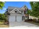 Attractive two-story home with a two-car garage and a combination of brick and siding at 209 Oswego Ct, Morrisville, NC 27560