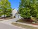 Two-story home with double garage, charming curb appeal, and mature landscaping at 209 Oswego Ct, Morrisville, NC 27560
