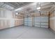 Spacious two car garage with finished floor and automatic door openers at 209 Oswego Ct, Morrisville, NC 27560