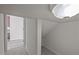 Hallway with storage nook and view of the kitchen with wood flooring at 209 Oswego Ct, Morrisville, NC 27560
