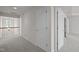 Second floor hallway with neutral carpet and access to bedrooms at 209 Oswego Ct, Morrisville, NC 27560