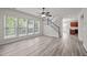 Spacious living room with hardwood floors and natural light near staircase at 209 Oswego Ct, Morrisville, NC 27560