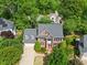 Aerial view of the house showcasing its well-manicured landscaping and attractive brick facade at 210 Highlands Lake Dr, Cary, NC 27518