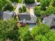 Back exterior of a home with a deck, patio, and nice landscaping at 210 Highlands Lake Dr, Cary, NC 27518