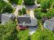 Home in quiet neighborhood featuring a back deck, a patio, and nice landscaping at 210 Highlands Lake Dr, Cary, NC 27518