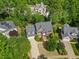 Beautiful brick home with a manicured lawn and mature trees in a desirable neighborhood at 210 Highlands Lake Dr, Cary, NC 27518