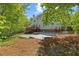 Spacious backyard with a patio area, perfect for outdoor gatherings and enjoying the surrounding greenery at 210 Highlands Lake Dr, Cary, NC 27518