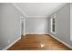 Bright bedroom with hardwood floors, fresh paint, and ample natural light at 210 Highlands Lake Dr, Cary, NC 27518