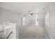 The bonus room features neutral paint, carpet, and ample natural light, creating a flexible and inviting space at 210 Highlands Lake Dr, Cary, NC 27518