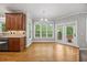 Light-filled breakfast nook with wood floors, built-in cabinets and backyard views at 210 Highlands Lake Dr, Cary, NC 27518
