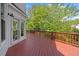Relax on this spacious red wood deck while overlooking the lush backyard at 210 Highlands Lake Dr, Cary, NC 27518