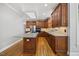 Stylish kitchen with granite countertops and stainless steel appliances at 210 Highlands Lake Dr, Cary, NC 27518