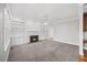 The living room has a fireplace, built-in shelves, and plush carpet at 210 Highlands Lake Dr, Cary, NC 27518