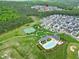 Aerial view featuring the community amenities like the tennis court, pool, and neighborhood homes at 213 North Crest Dr, Chapel Hill, NC 27517