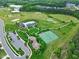 Overhead shot of community amenities including golf course, pool, tennis courts, playground, and parking at 213 North Crest Dr, Chapel Hill, NC 27517