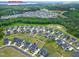 Aerial shot showcases a community near Jordan Lake, nestled among trees and a clubhouse at 213 North Crest Dr, Chapel Hill, NC 27517