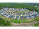 Aerial view of a suburban neighborhood showcases the well-maintained lawns and circular layout at 213 North Crest Dr, Chapel Hill, NC 27517