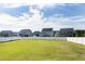Large grassy backyard, enclosed by a white picket fence, perfect for outdoor activities at 213 North Crest Dr, Chapel Hill, NC 27517