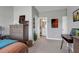 Bedroom featuring a dresser, desk, and access to an ensuite bathroom at 213 North Crest Dr, Chapel Hill, NC 27517