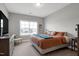 Bedroom with large window for natural light and a dresser with television at 213 North Crest Dr, Chapel Hill, NC 27517