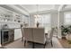 Elegant dining room featuring a stylish chandelier, built-in shelving, and a sophisticated bar area for entertaining at 213 North Crest Dr, Chapel Hill, NC 27517