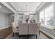 Chic dining room with sophisticated lighting and adjacent wet bar, perfect for entertaining guests in style at 213 North Crest Dr, Chapel Hill, NC 27517