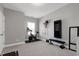 Home gym with workout equipment including stationary bike, weight bench, wall mirror, and wall mounted weight rack at 213 North Crest Dr, Chapel Hill, NC 27517